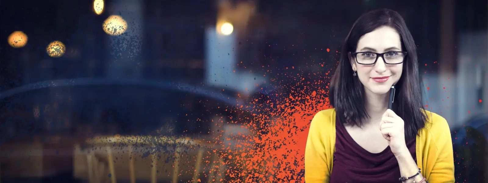 Ncve trainer smiling, with an orange paint spray