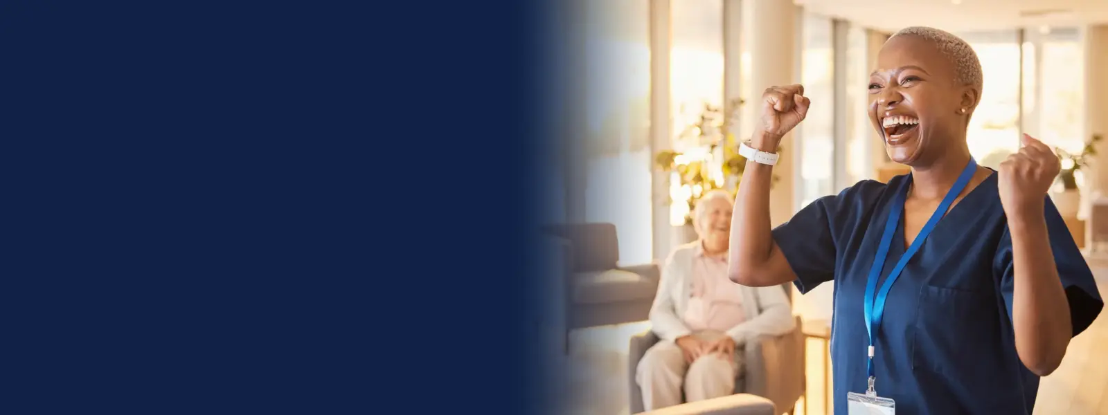 Aged care worker celebrating in a bright aged care lounge